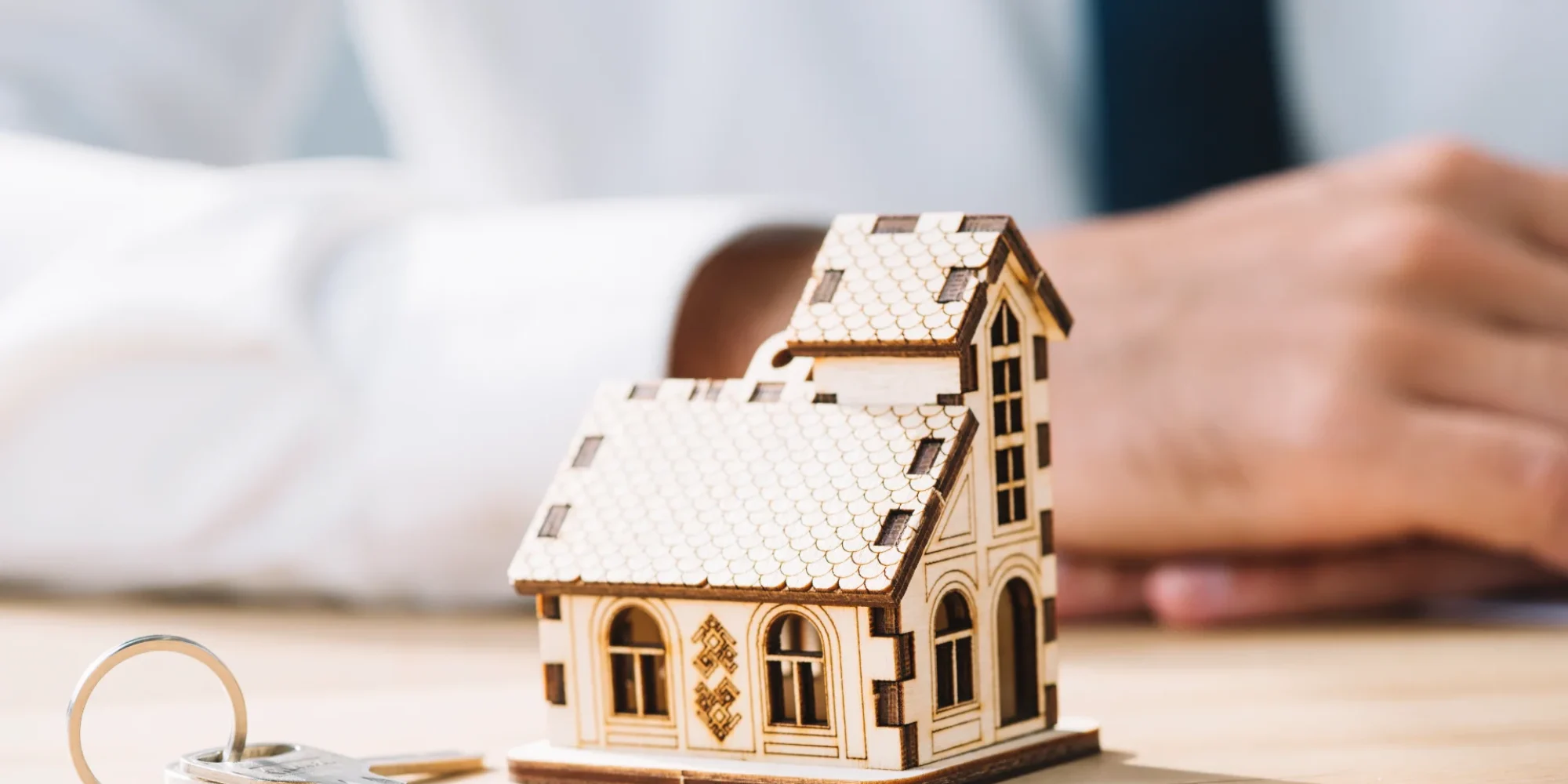 close-up-house-keys-near-real-estate-agent