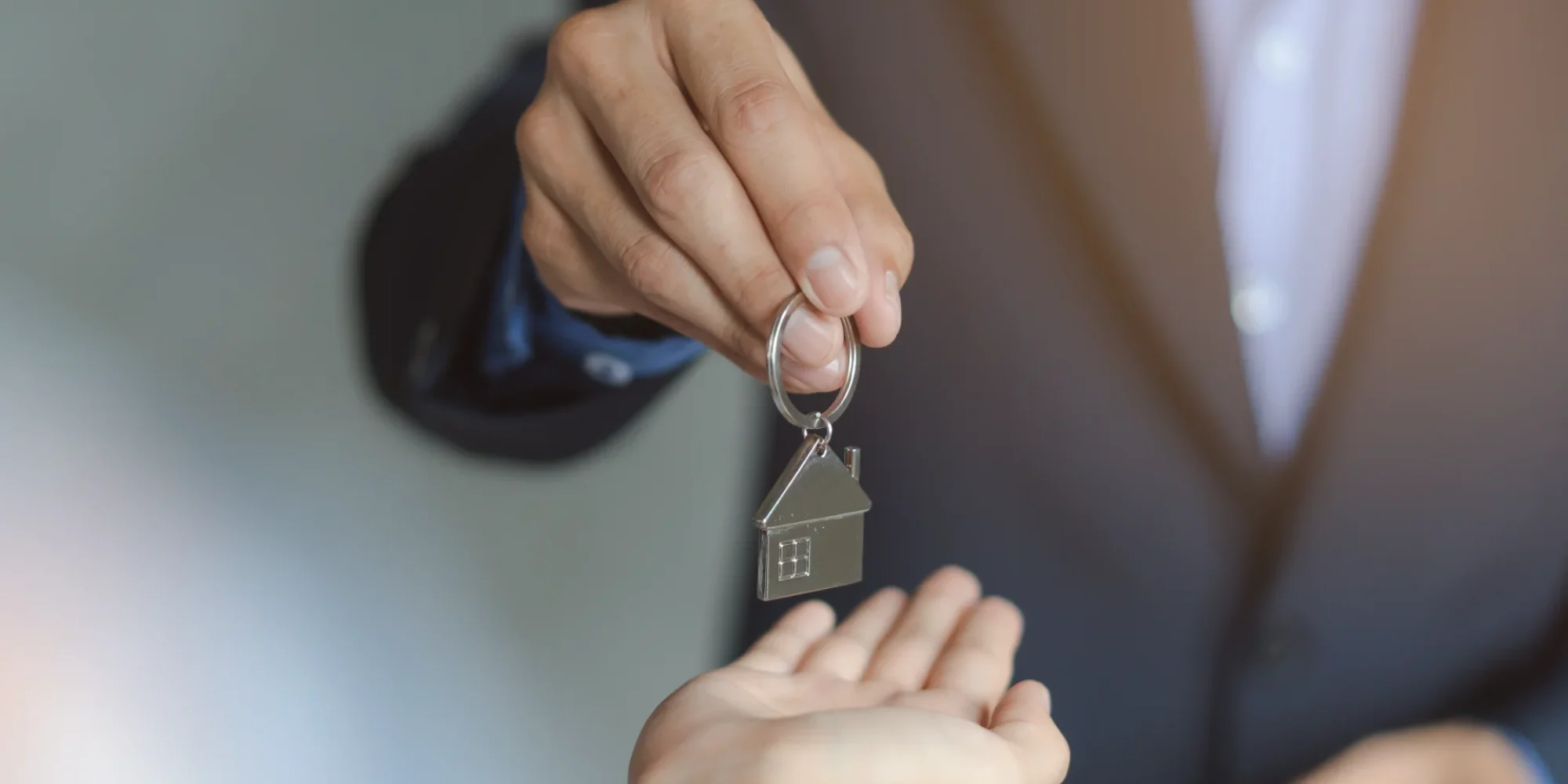 hand-property-realtor-landlord-giving-key-house-buyer-tenant